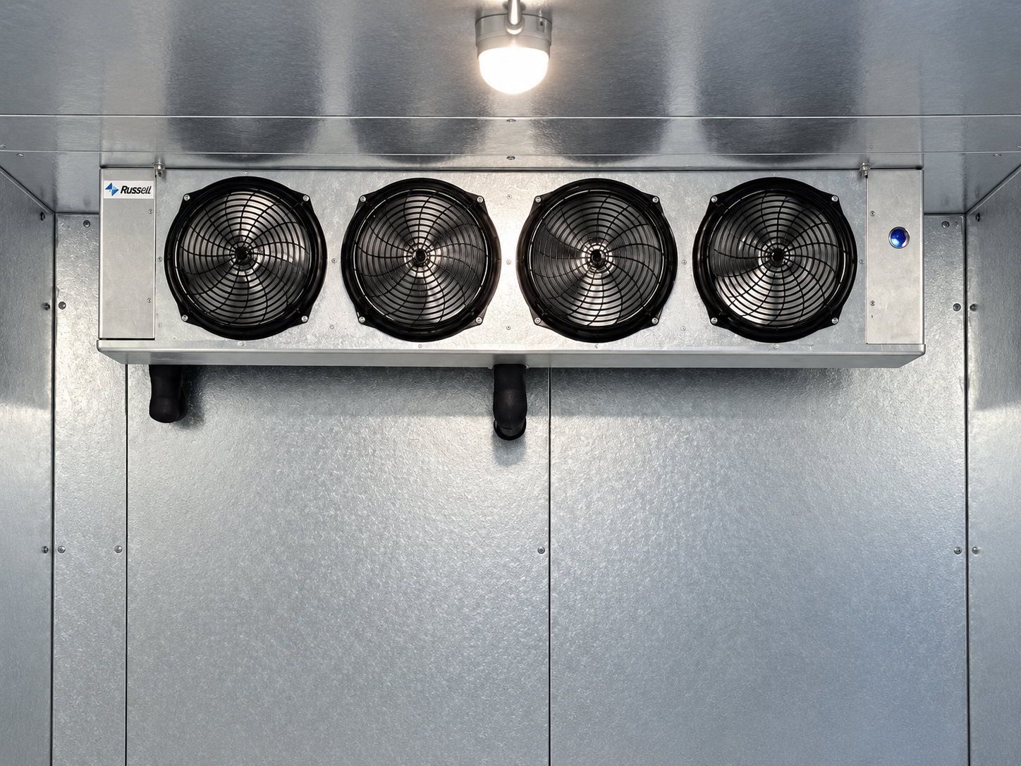 Ceiling-mounted refrigeration evaporator with four fans inside a walk-in enclosure